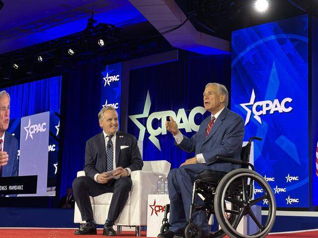 Texas Gov. Greg Abbott and state Sen. Bryan Hughes speak at CPAC in Grapevine on March 27.